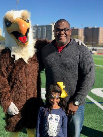 Serge Georges posing picture with bird dressed man