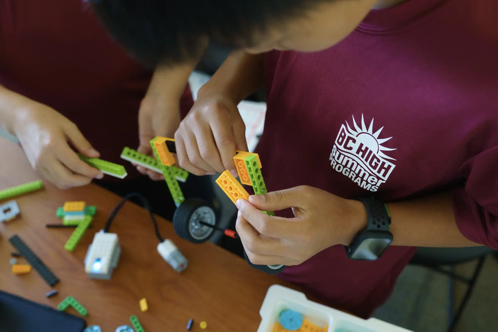 Two BC High summer program students work together on a project