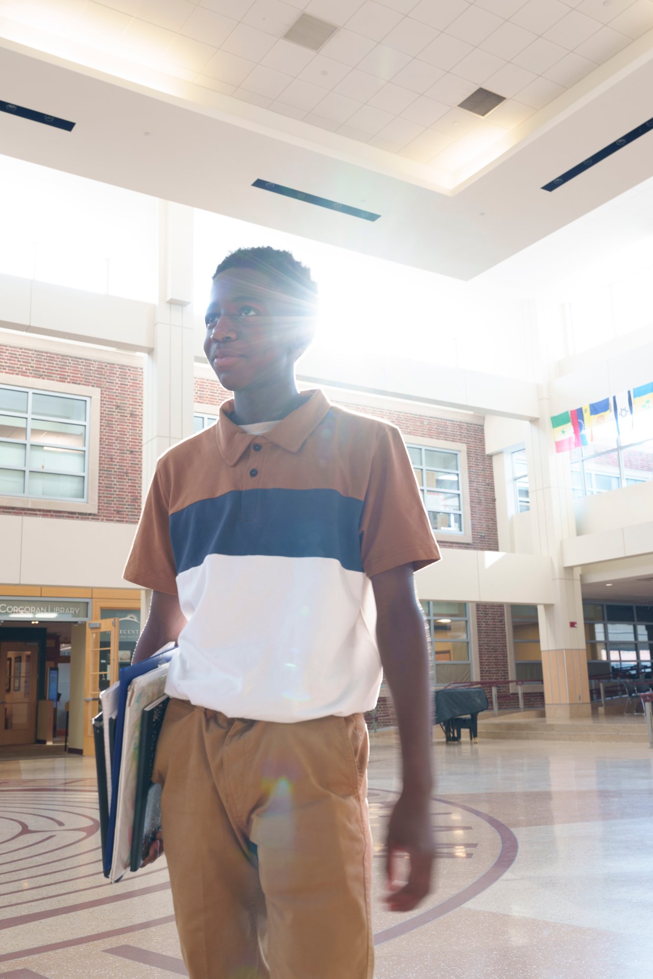 student in commons with light in background